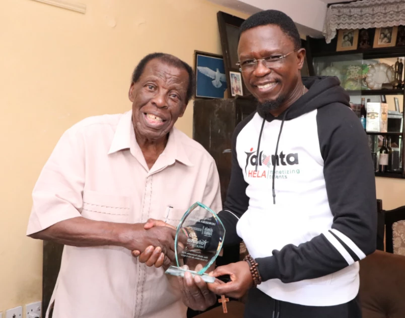 CS Ababu Awards Leonard Mambo Mbotela Ksh.1M For His ‘Contribution To The Nation’